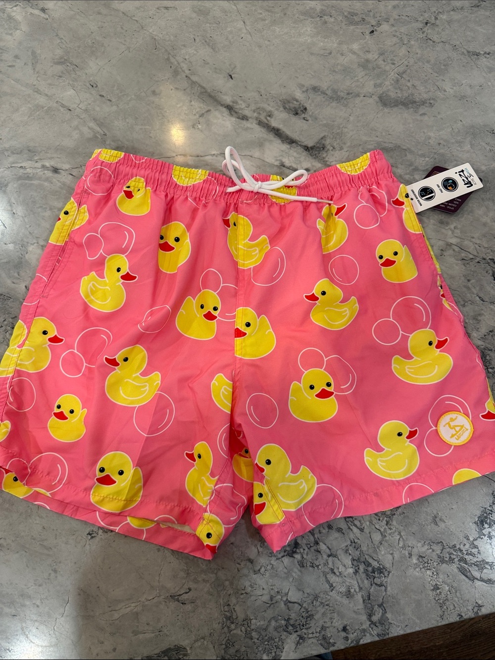 Men's Pink Swim Trunks with Yellow Duck Print -